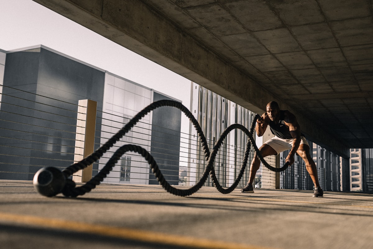 Athlete training with battle ropes